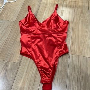 Red silk type body suit never worn